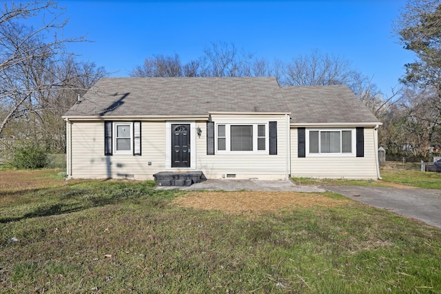 view of front of home with crawl space, a front yard, and roof with shingles