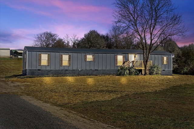 view of front of home with board and batten siding and metal roof