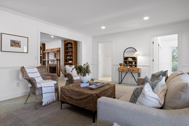 living room with recessed lighting, baseboards, light colored carpet, and ornamental molding