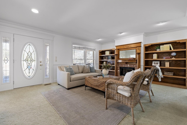 living area featuring visible vents, a brick fireplace, crown molding, light carpet, and recessed lighting