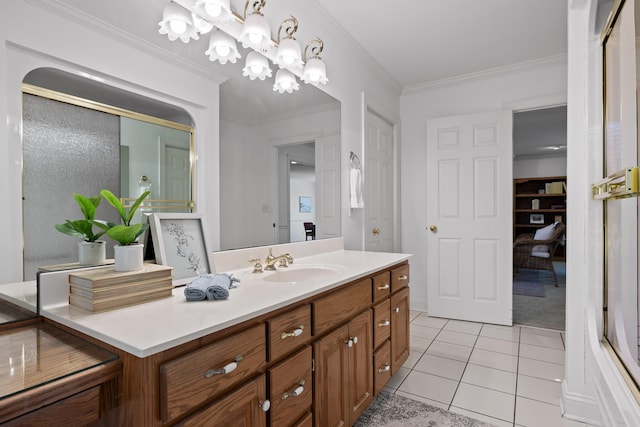 bathroom with tile patterned flooring, a chandelier, vanity, and ornamental molding