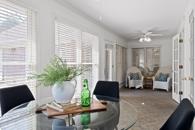 interior space with crown molding, a ceiling fan, and french doors