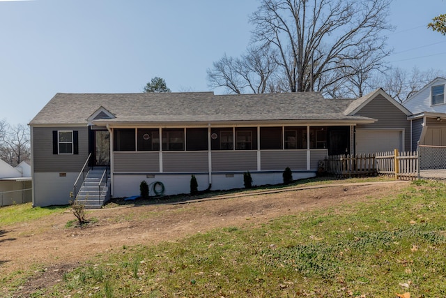 ranch-style house featuring crawl space, fence, roof with shingles, and a sunroom