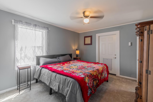 bedroom with ceiling fan, carpet flooring, baseboards, and ornamental molding