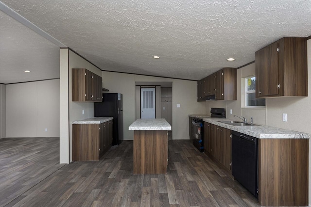 kitchen featuring black appliances, light countertops, dark wood-style flooring, and a kitchen island