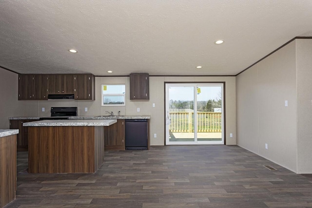 kitchen with under cabinet range hood, dark wood-style floors, black appliances, and a sink