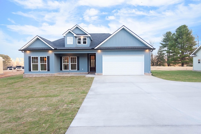 view of front of home with a garage, concrete driveway, a front lawn, and roof with shingles