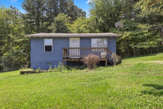 view of front of home featuring a front lawn, a wooden deck, and crawl space