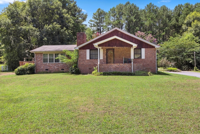 ranch-style home with crawl space, brick siding, a chimney, and a front lawn