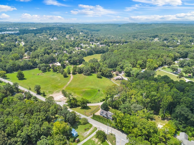 bird's eye view featuring a wooded view