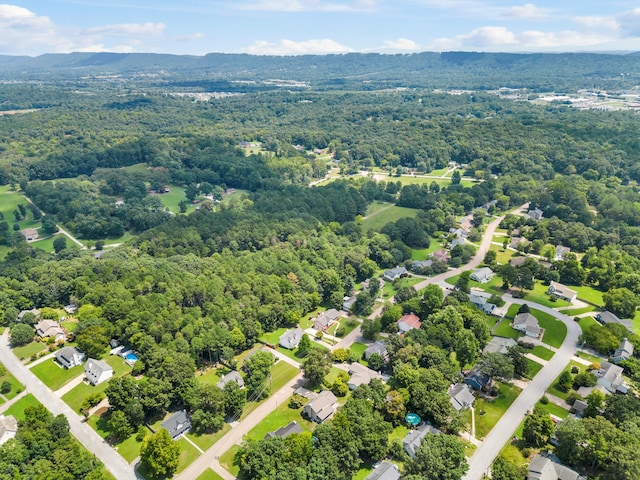 aerial view featuring a wooded view