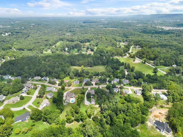 drone / aerial view featuring a view of trees