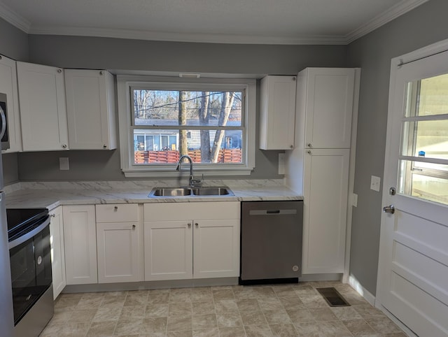 kitchen featuring visible vents, white cabinets, appliances with stainless steel finishes, and a sink