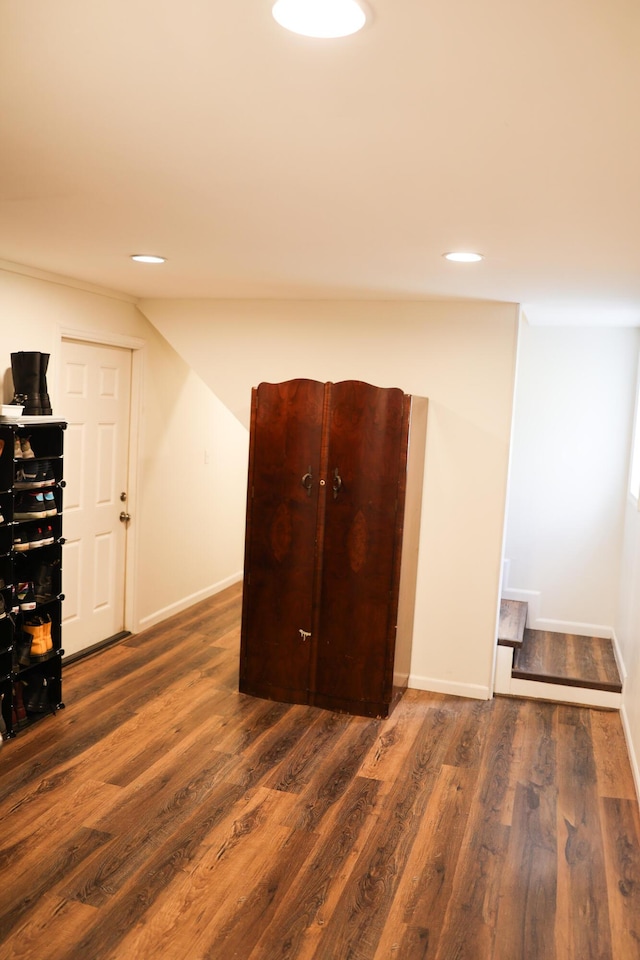 interior space with wood finished floors and baseboards