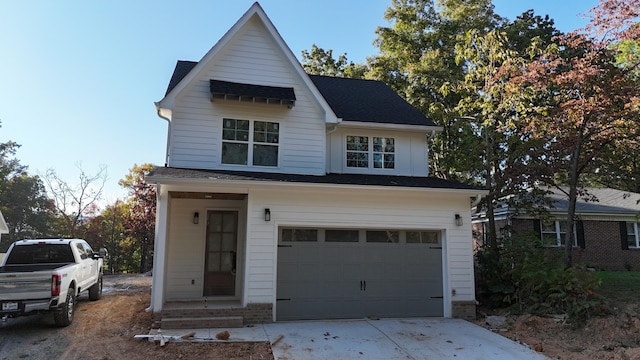 view of front of house with a garage and driveway