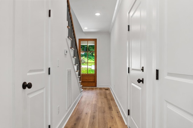 entryway with light wood finished floors, visible vents, recessed lighting, and baseboards