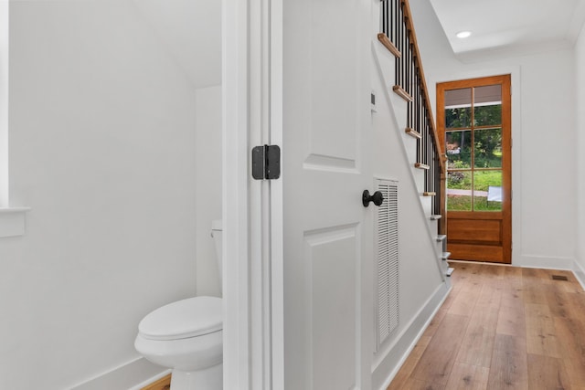 bathroom featuring recessed lighting, baseboards, toilet, and hardwood / wood-style flooring