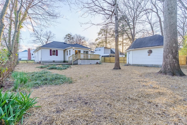 view of yard featuring a deck and a fenced backyard