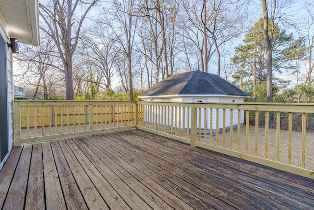 wooden deck featuring an outdoor structure