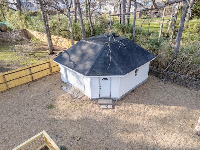 view of outbuilding with an outdoor structure and a fenced backyard