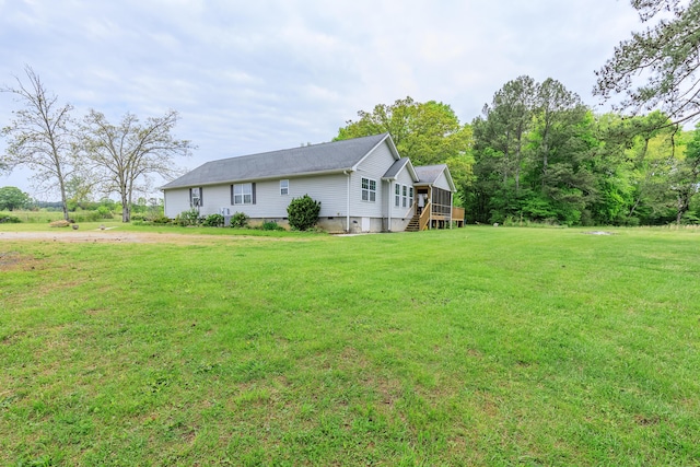 view of home's exterior featuring crawl space, a yard, and dirt driveway