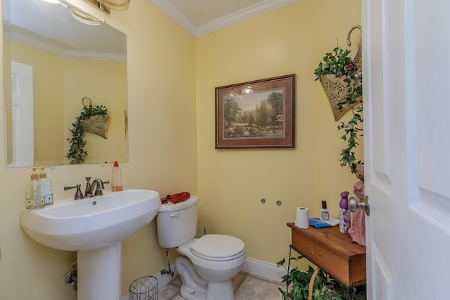 half bathroom with baseboards, toilet, ornamental molding, and tile patterned flooring