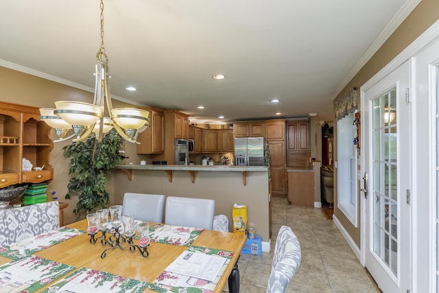 dining room featuring crown molding, a notable chandelier, recessed lighting, and light tile patterned floors