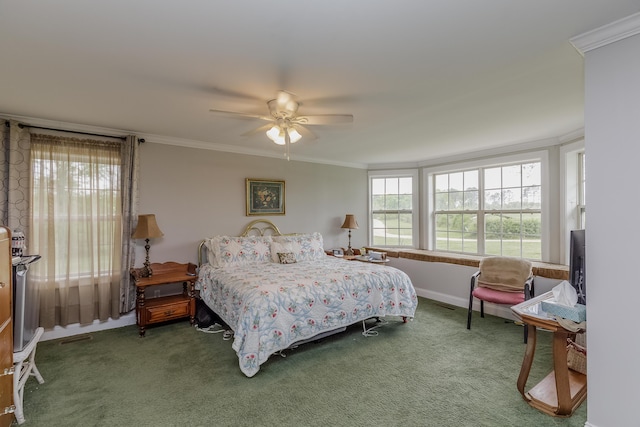 bedroom with crown molding, carpet floors, and ceiling fan