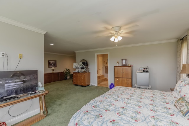 bedroom featuring ensuite bath, crown molding, carpet flooring, and a ceiling fan