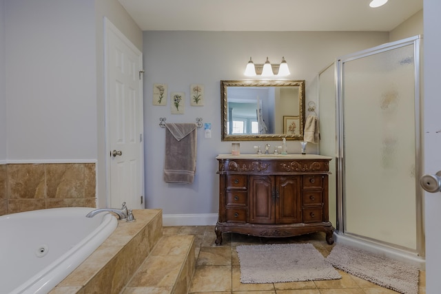 bathroom featuring vanity, a tub with jets, baseboards, tile patterned flooring, and a shower stall