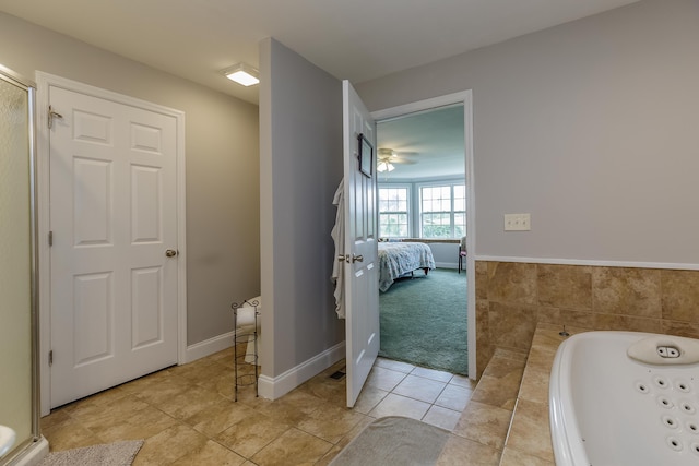 full bathroom featuring tile patterned floors, ensuite bathroom, baseboards, and a whirlpool tub