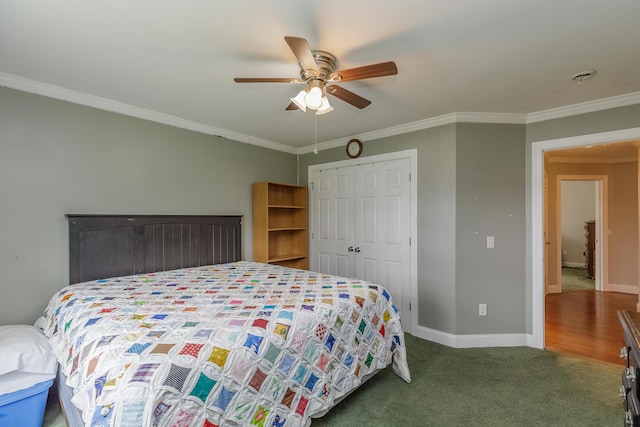 bedroom featuring baseboards, carpet floors, ceiling fan, a closet, and crown molding