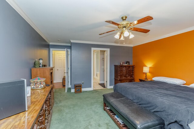 bedroom with ornamental molding, a ceiling fan, connected bathroom, carpet, and baseboards