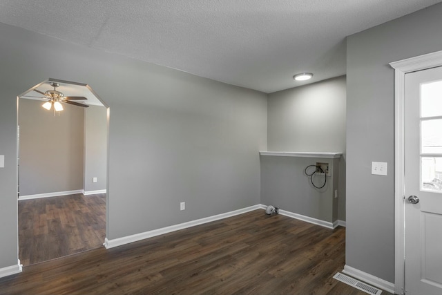 laundry room with hookup for a washing machine, a ceiling fan, visible vents, baseboards, and dark wood finished floors