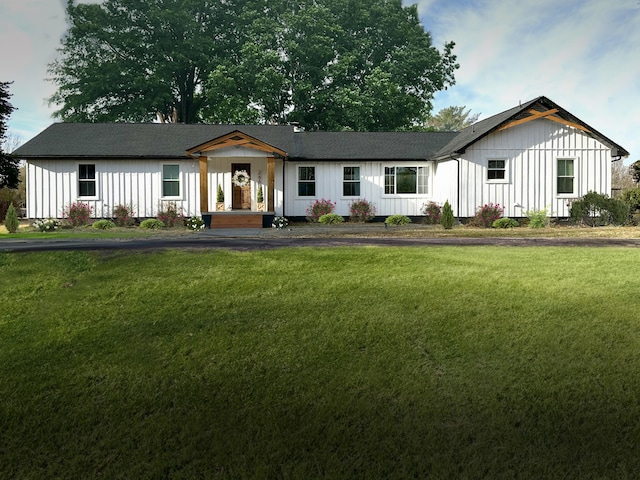 266 Carolina Ave, Delano, TN 37325 - ranch-style home featuring board and batten siding and a front lawn