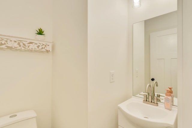 bathroom featuring toilet and a sink