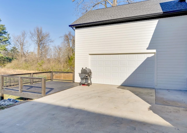 garage with concrete driveway