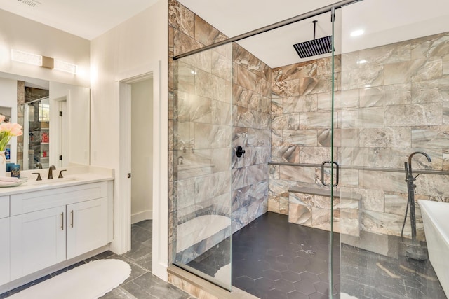 full bathroom featuring visible vents, a stall shower, and vanity