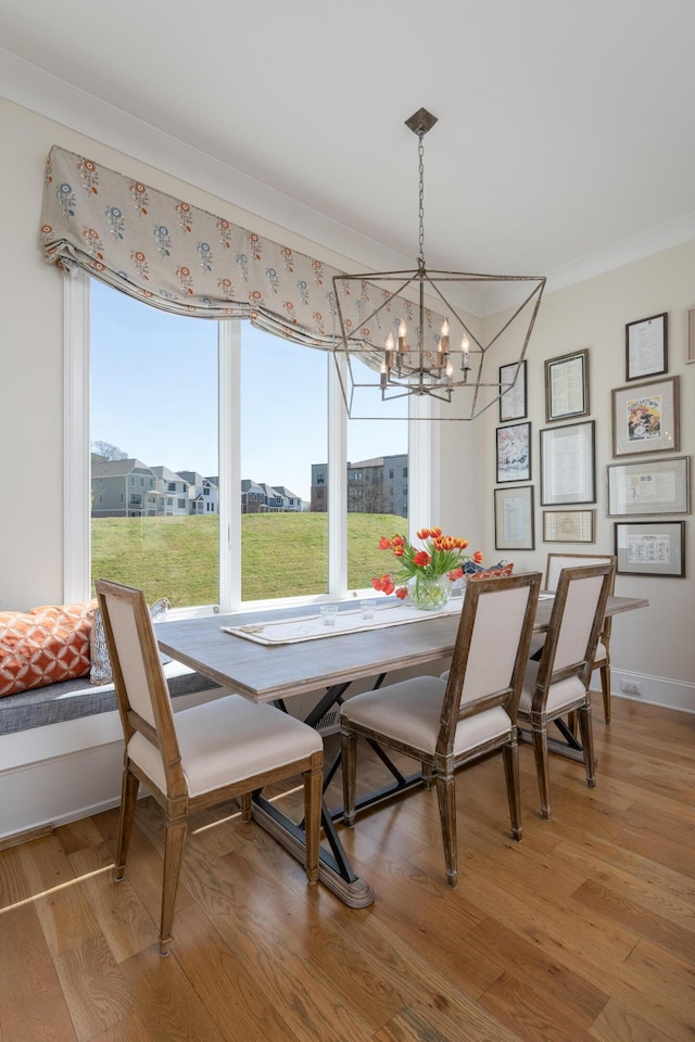 778 Latitude Cir, Chattanooga, TN 37402 - dining area featuring a chandelier, ornamental molding, light wood-style flooring, and baseboards