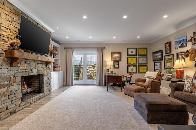 778 Latitude Cir, Chattanooga, TN 37402 - living area with crown molding, recessed lighting, a stone fireplace, light wood finished floors, and baseboards
