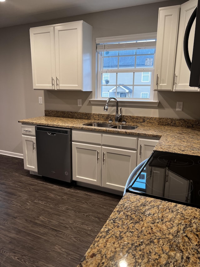 kitchen with dishwasher, dark wood-style floors, white cabinetry, and a sink