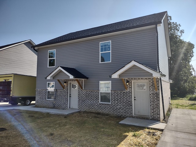 view of front of house with brick siding