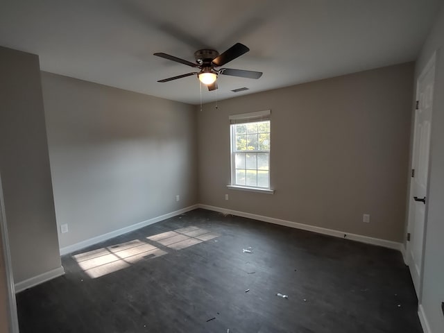 unfurnished room featuring visible vents, baseboards, and a ceiling fan