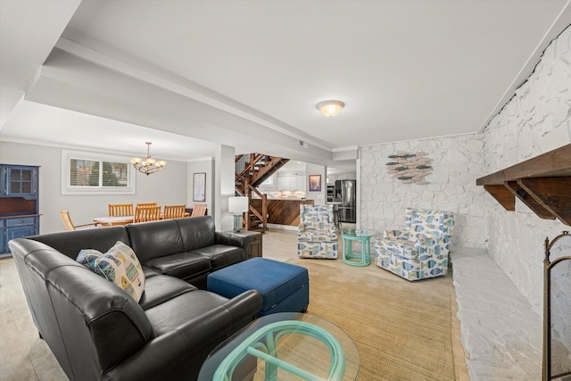 living area with crown molding, stairway, a notable chandelier, and light carpet