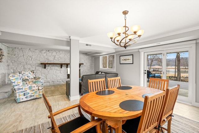 dining space with visible vents and a chandelier