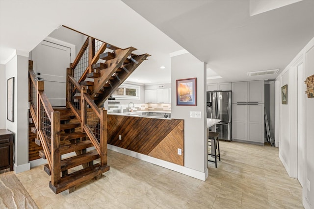 stairway featuring recessed lighting and visible vents