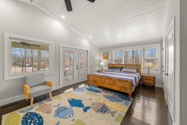 bedroom featuring access to exterior, baseboards, lofted ceiling, and hardwood / wood-style floors