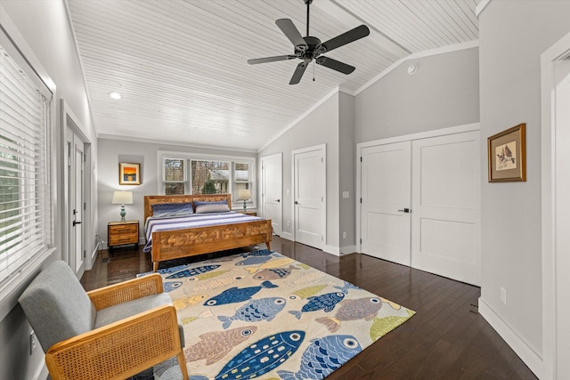 bedroom with baseboards, lofted ceiling, wood-type flooring, and ornamental molding