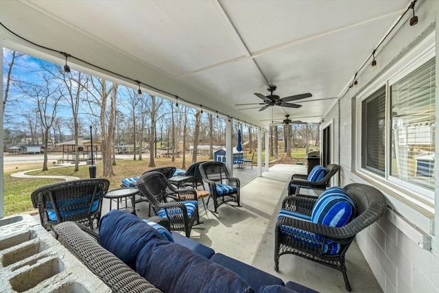 view of patio / terrace with outdoor lounge area, a ceiling fan, and covered porch