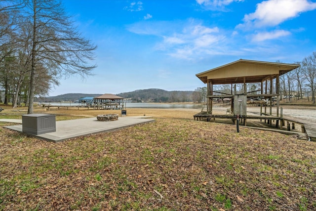 exterior space featuring a gazebo and a water view